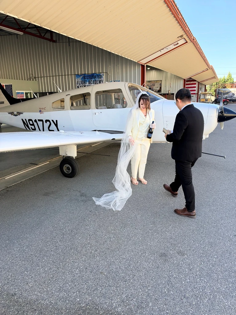 Wedding celebration beside N9172Y outside the Accelerated Flight Academy hangar